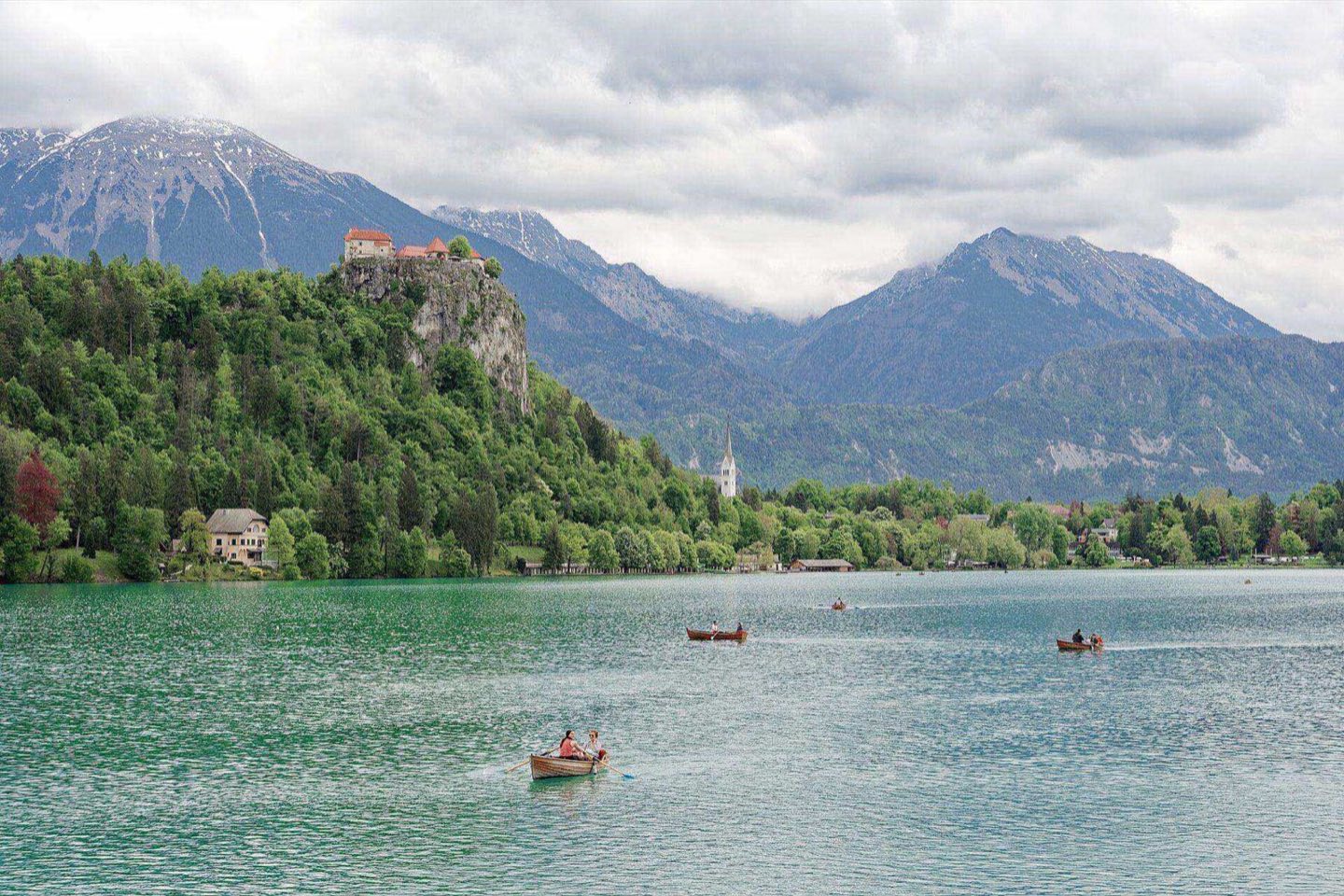 Bled Castle perched on its cliff above the emerald water of Lake Bled
