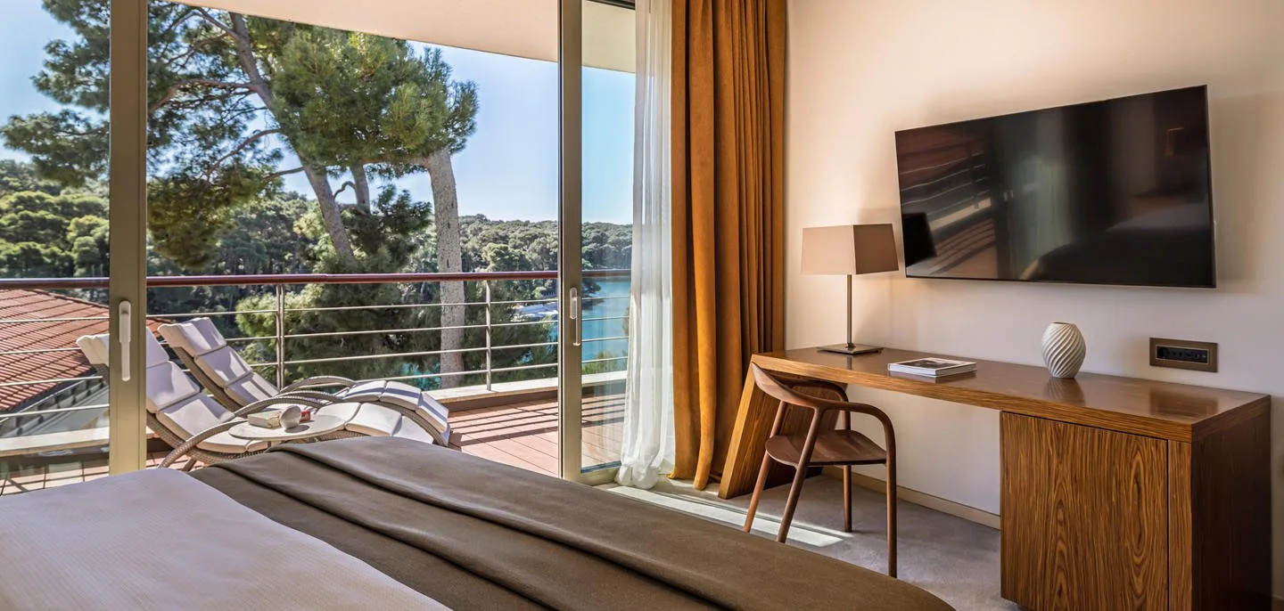 Bedroom and balcony view in the Čikat Bay Suite at Boutique Hotel Alhambra