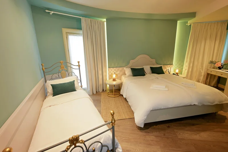 Double and single beds in the Family Comfort room at Çoçja Boutique Hotel