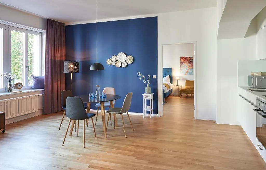 Kitchen, dining room and bedroom at Neustadt Apartments