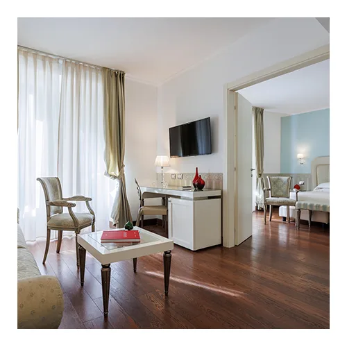 Living and sleeping areas in the Oriente Suite at JR Hotels Oriente Bari