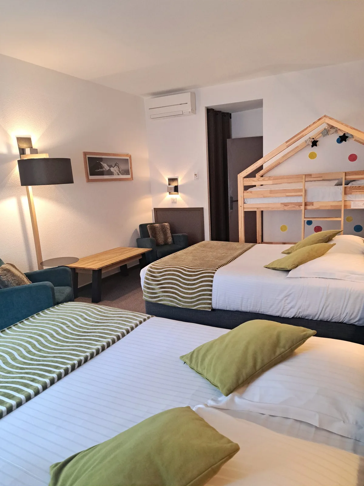 Double and bunk beds in the Family Room at Hôtel des Princes